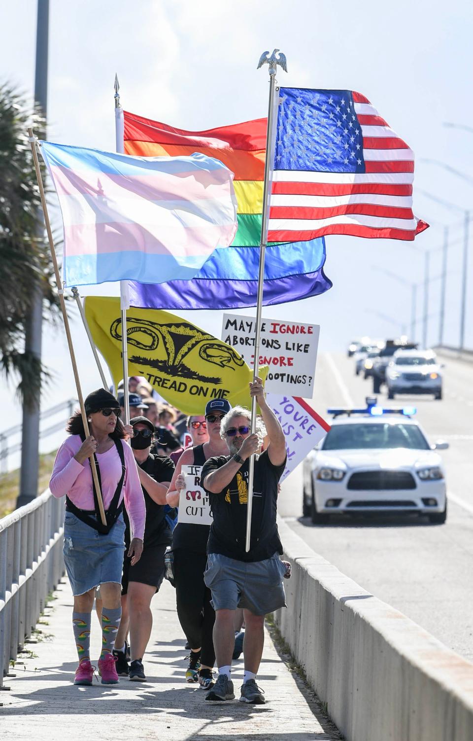 Supporters of abortion rights march along the Eau Gallie Causeway Saturday, April 8, 2023 during the Shove Your 6 Week Ban rally. Craig Bailey/FLORIDA TODAY via USA TODAY NETWORK