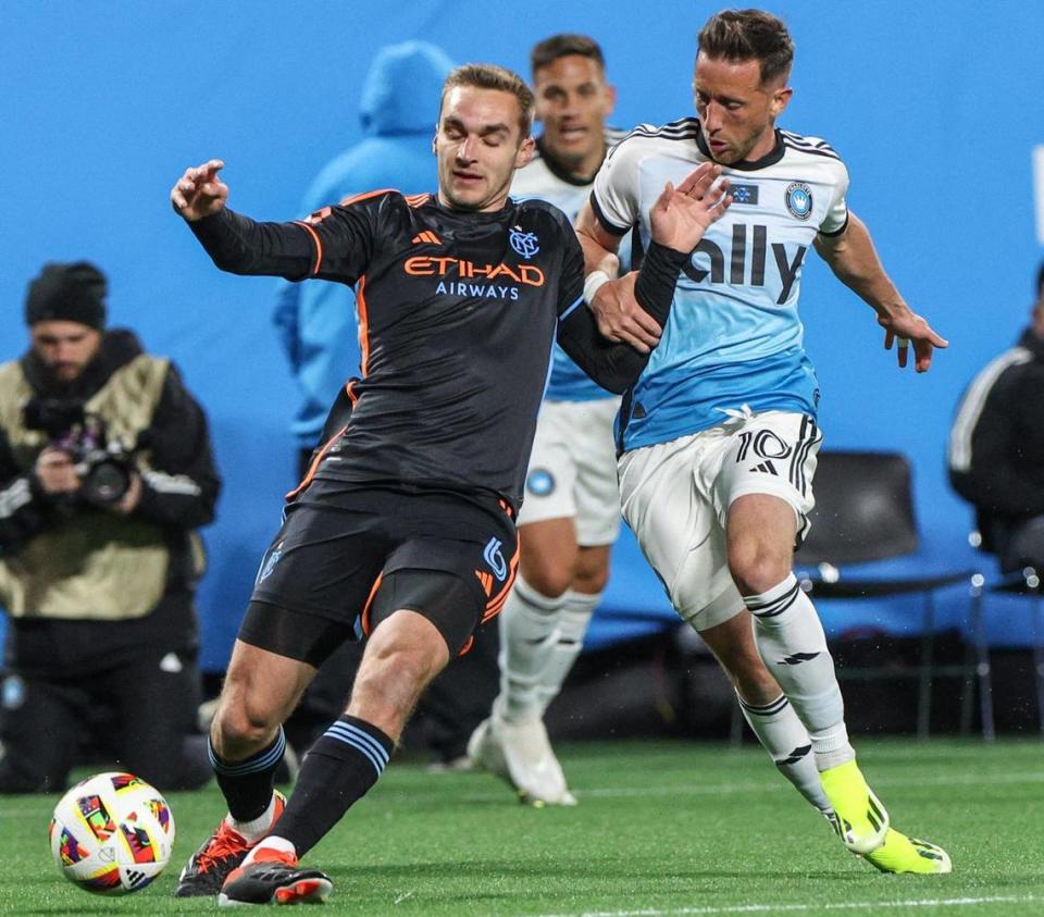 Charlotte FC’s Brecht Dejaegere, right, defends as New York City FC’s James Sands dribbles the ball during the home opener at Bank of America Stadium in Charlotte, NC on February 24, 2024.