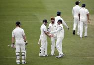 New Zealand's Brendon McCullum is congratulated by India's players as he leaves the field out for 302 during the second innings of play on day five of the second international test cricket match at the Basin Reserve in Wellington, February 18, 2014. REUTERS/Anthony Phelps (NEW ZEALAND - Tags: SPORT CRICKET)