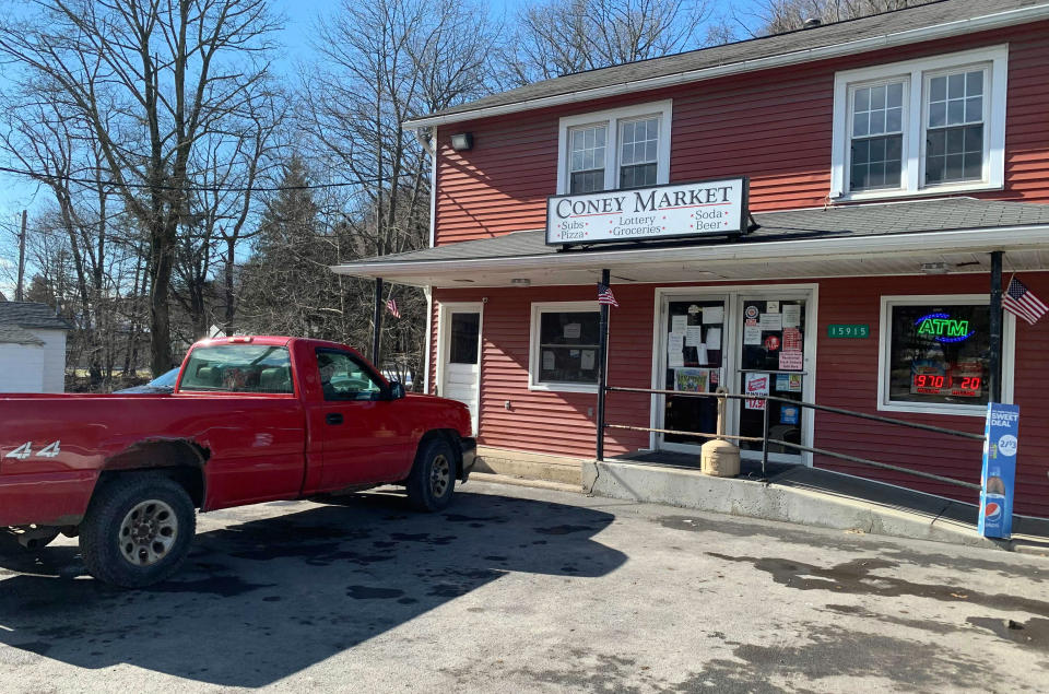 A pickup truck is parked by the Coney Market in Lonaconing, Md. a 1,200-person town in Western Maryland, where a winning, $731.1 million Powerball ticket was sold last week, Thursday, Jan. 21, 2021. (Colin Campbell/The Baltimore Sun via AP)