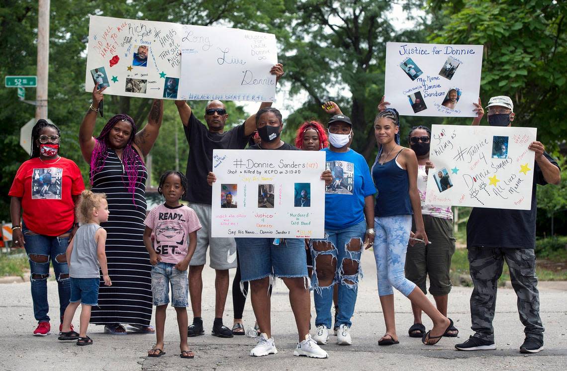 The family of Donnie Sanders, including sisters, Kianna Benton (back, left in red), Youlanda Sanders, (center) and Reshonda Sanders (in front in blue) and others gathered to talk about police brutality and seeking justice for Donnie, 47, who died after being shot by a Kansas City police officer in March. Donnie, who fled on foot after an attempted traffic stop, was shot near E. 52nd Street and Wabash Avenue on March 13 in Kansas City. He was unarmed. Tammy Ljungblad/tljungblad@kcstar.com