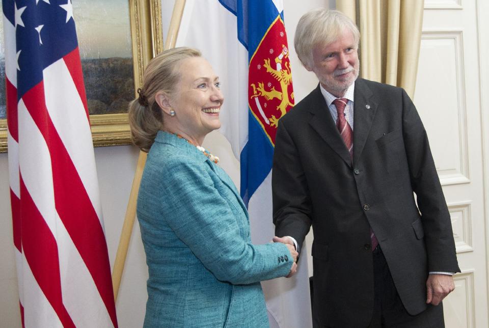 U.S. Secretary of State Hillary Rodham Clinton shakes hands with Finnish Foreign Minister Erkki Tuomioja, Wednesday, June 27, 2012, at the Government Banquet Hall in Helsinki, Finland. (AP Photo/Haraz N. Ghanbari, Pool)