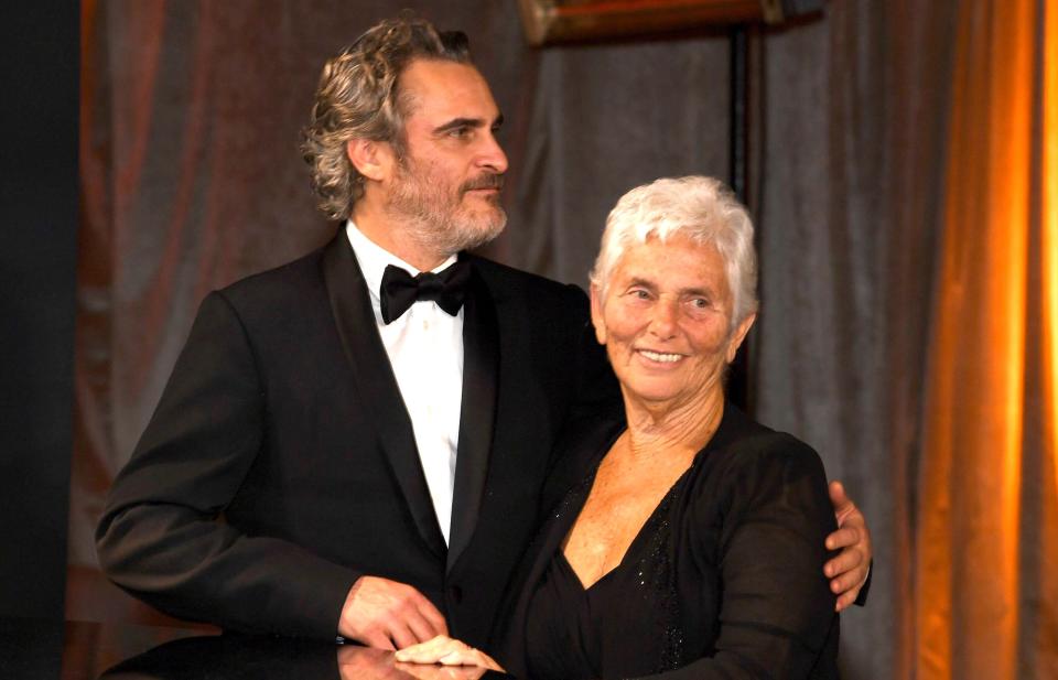 First-time Academy Award winner Joaquin Phoenix hangs out with his mom, Arlyn, at the Governor's Ball. 