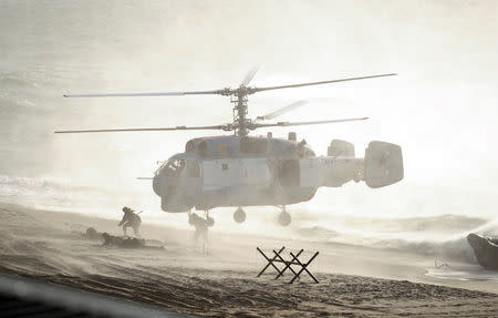 FILE PHOTO: Servicemen take part in the joint war games Zapad-2013 (West-2013), attended by Russian President Vladimir Putin and President of Belarus Alexander Lukashenko, at the Khmelevka range on Russia's Baltic Sea in the Kaliningrad Region, Russia September 26, 2013. REUTERS/Alexei Druzhinin/RIA Novosti/Kremlin/File Photo