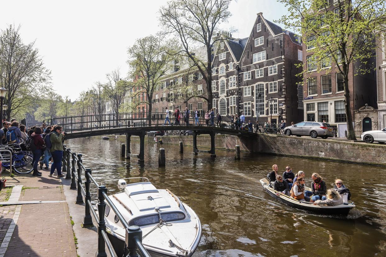 The city of Amsterdam, in the Netherlands, is trying to create an economy that can meet people&rsquo;s needs without causing irreparable damage to the climate and nature. Credit: Nicolas Economou/NurPhoto via Getty Images (Photo: )