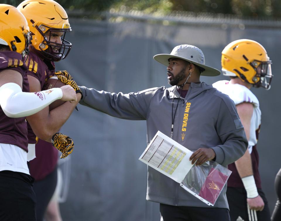 Arizona State Sun Devils WR coach/passing game coordinator Ra'Shaad Samples instructs his players during spring football practice at the Kajikawa practice fields in Tempe on March 16, 2023.