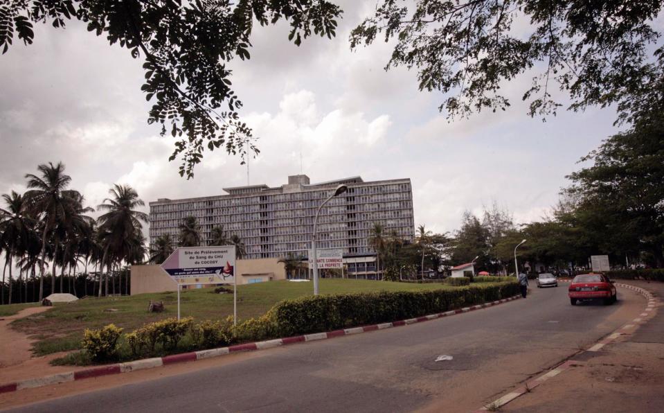 In this photo taken on Thursday, April 3, 2014, the outside of the University Hospital where Ivorian fashion model Awa Fadiga was treated in Abidjan, Ivory Coast. Awa Fadiga was attacked at night in a taxi that was taking her home to an upscale neighborhood in Ivory Coast’s capital. Two witnesses say they saw the locally famous fashion model being thrown out of the cab under a bridge, apparently unconscious. Firefighters rushed the 23-year-old to the Central University Hospital where she was left untreated for more than 12 hours and slipped into a coma _ all because there was no one immediately available to pay her medical fees, her family said. (AP Photo/Sevi Herve Gbekide )