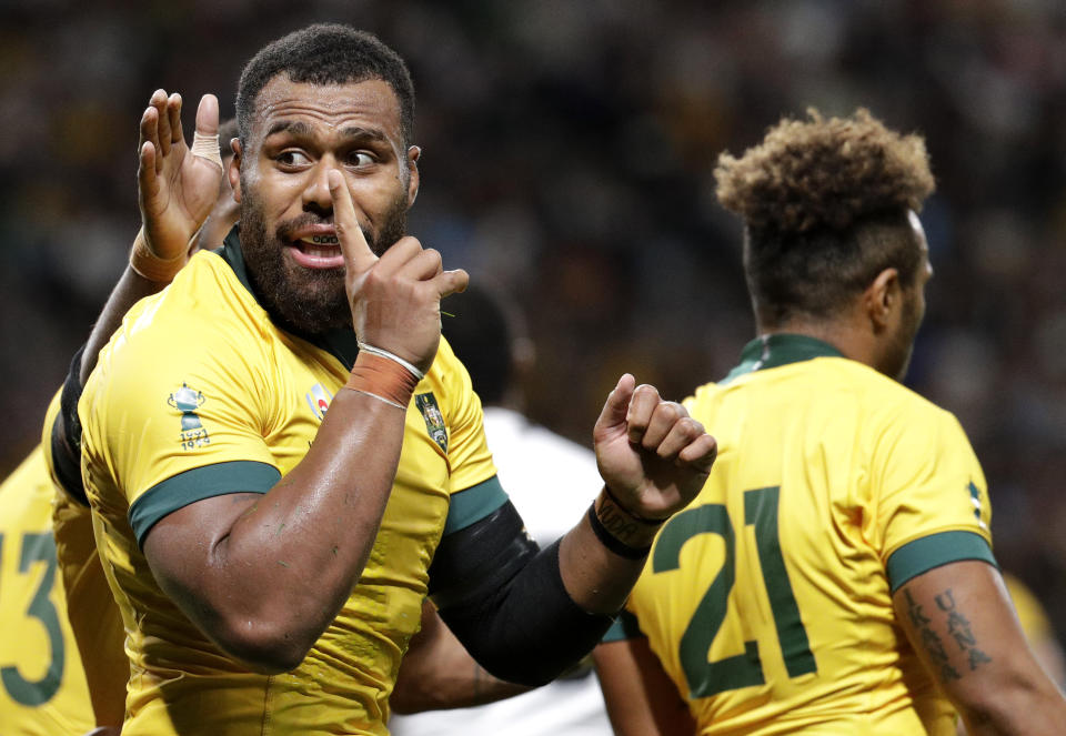 Australia's Samu Kerevi celebrates after scoring a try during the Rugby World Cup Pool D game at Sapporo Dome between Australia and Fiji in Sapporo, Japan, Saturday, Sept. 21, 2019. (AP Photo/Aaron Favila)