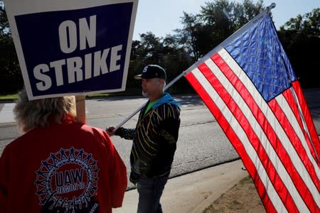 FILE PHOTO: Striking union workers walk the picket line outside the GM Flint Truck Assembly in Flint