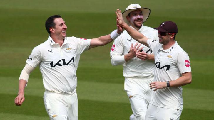 Surrey's Dan Worrall (left) celebrates a Hampshire wicket