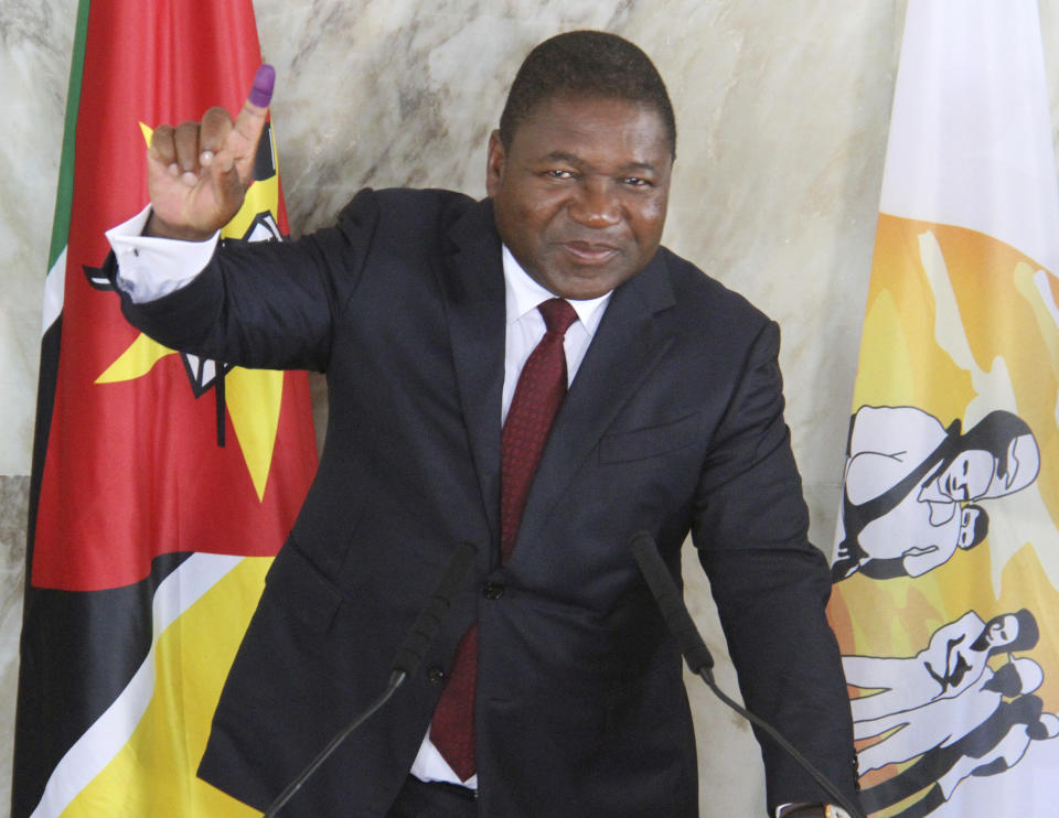 Mozambican President Felipe Nyusi poses at a polling station where he cast his vote in Maputo, Tuesday, Oct. 15, 2019 in the country's presidential, parliamentary and provincial elections. Polling stations opened across the country with 13 million voters registered to cast ballots in elections seen as key to consolidating peace in the southern African nation. (AP Photo/Ferhat Momade)