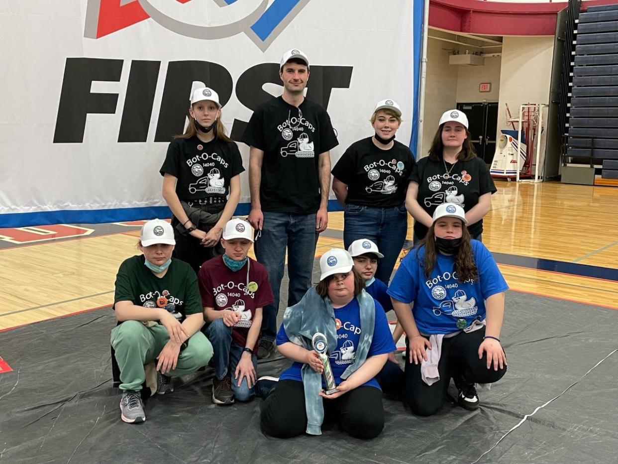The Concord Academy Bot-O-Caps pose with their first-place trophy after winning the FIRST Tech Challenge in Big Rapids on Friday and Saturday, May 6-7.