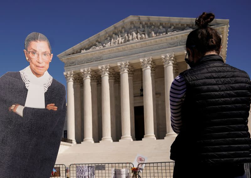 People gather to mourn the death of Associate Justice Ruth Bader Ginsburg at the Supreme Court in Washington