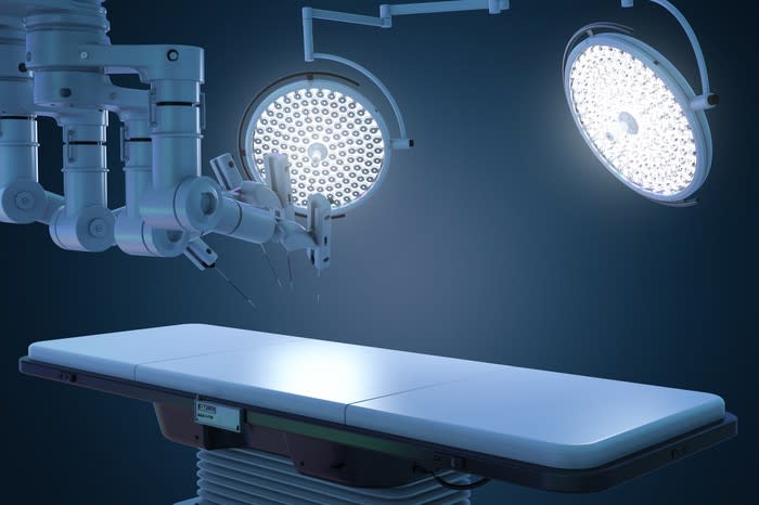 Surgical table with surgical robot by it