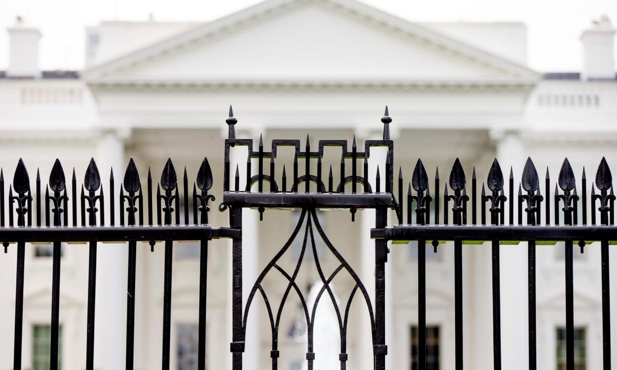 <span>White House is visible through the fence at the North Lawn in Washington.</span><span>Photograph: Andrew Harnik/AP</span>