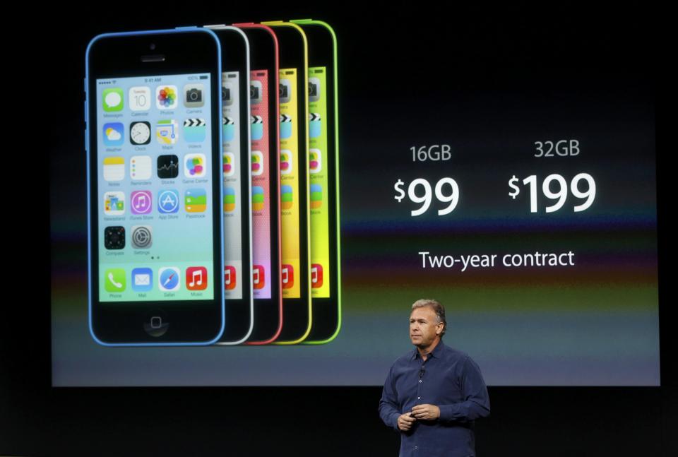 Phil Schiller, senior vice president of worldwide marketing for Apple Inc, talks about the pricing of the new iPhone 5C at Apple Inc's media event in Cupertino, California September 10, 2013. REUTERS/Stephen Lam (UNITED STATES - Tags: BUSINESS SCIENCE TECHNOLOGY BUSINESS TELECOMS)