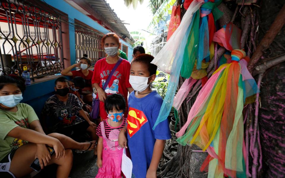 Thai people wait to undergo a nasal swab to test for Covid-19 - Narong Sangnak/EPA-EFE/Shutterstock