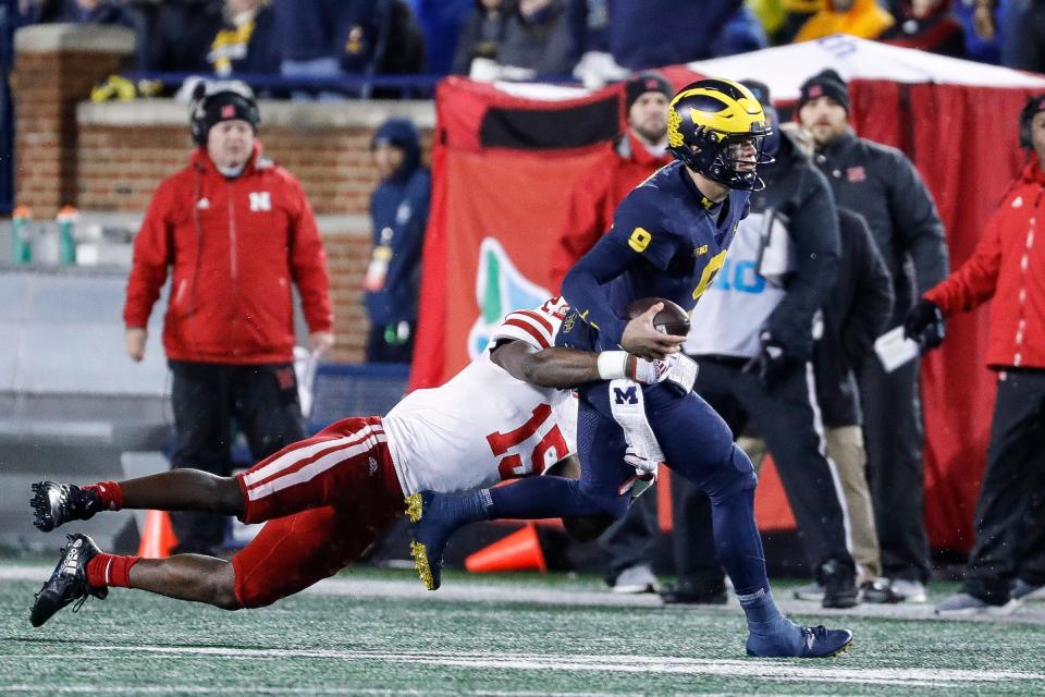 Nebraska linebacker Ernest Hausmann tackles Michigan quarterback J.J. McCarthy during the second half of U-M's 34-3 win over Nebraska on Saturday, Nov. 12, 2022, in Ann Arbor.