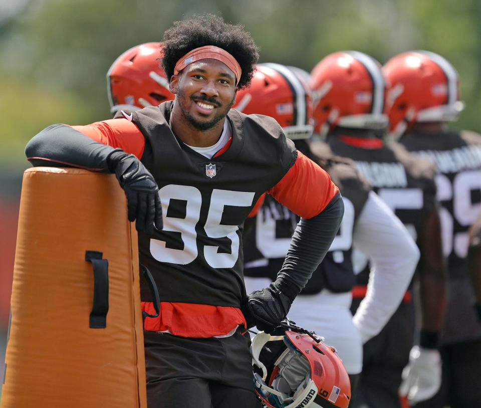 Myles Garrett smiles at the crowd during training camp, Friday, July 30, 2021.