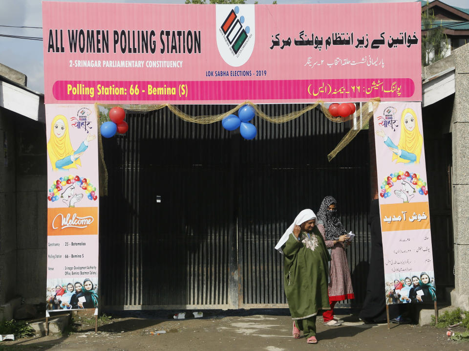 Kashmiri women voter exit a polling station after casting their votes during the second phase of India's general elections, on the outskirts of Srinagar, Indian controlled Kashmir, Thursday, April 18, 2019. Kashmiri separatist leaders who challenge India's sovereignty over the disputed region have called for a boycott of the vote. Most polling stations in Srinagar and Budgam areas of Kashmir looked deserted in the morning with more armed police, paramilitary soldiers and election staff present than voters. (AP Photo/Mukhtar Khan)