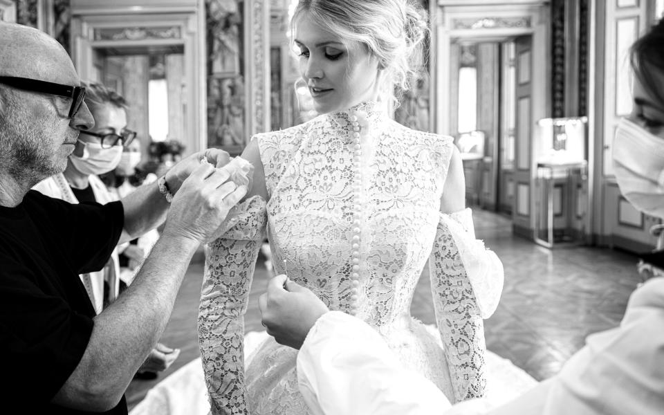 Domenico Dolce puts the finishing touches to Lady Kitty's wedding dress - Dolce and Gabbana