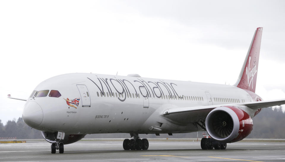 A Virgin Atlantic Boeing 787-9 passenger airplane arrives following a flight from London to Seattle, Monday, March 27, 2017, at Seattle-Tacoma International Airport in Seattle. Sir Richard Branson, the founder of Virgin Atlantic and the Virgin Group, was onboard to help launch Virgin Atlantic's new daily service between London Heathrow and Seattle, replacing flights currently operated by Virgin partner Delta Air Lines. (AP Photo/Ted S. Warren)