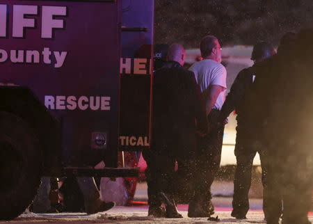 A suspect is taken into custody outside a Planned Parenthood center in Colorado Springs, Colorado November 27, 2015. REUTERS/Isaiah J. Downing