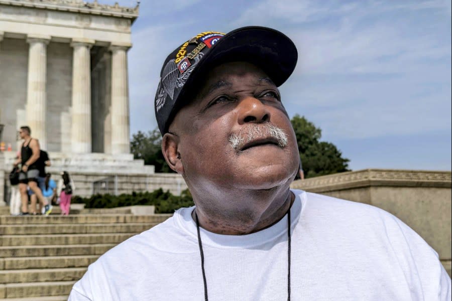 Tommie Babbs, 72, looks out across the reflecting pond by the Lincoln Memorial in Washington on Aug. 11, 2023. (AP Photo/Nathan Ellgren)