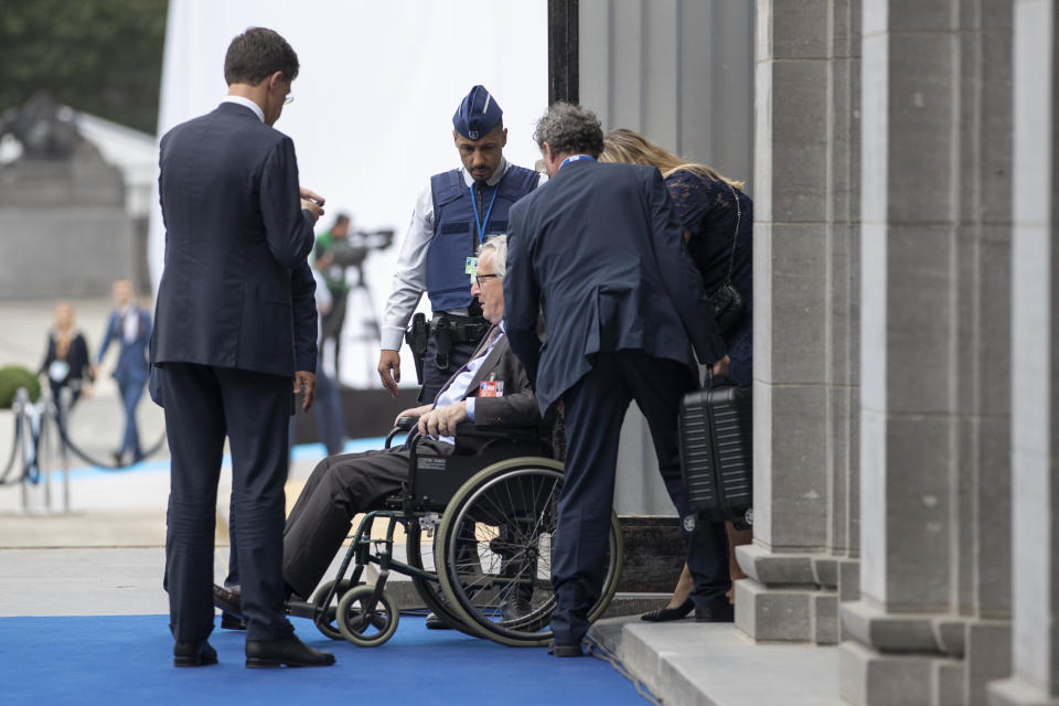 Juncker leaves the event in a wheelchair (Getty)