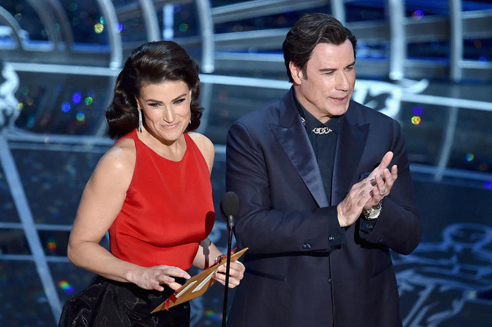 The two onstage presenting an award