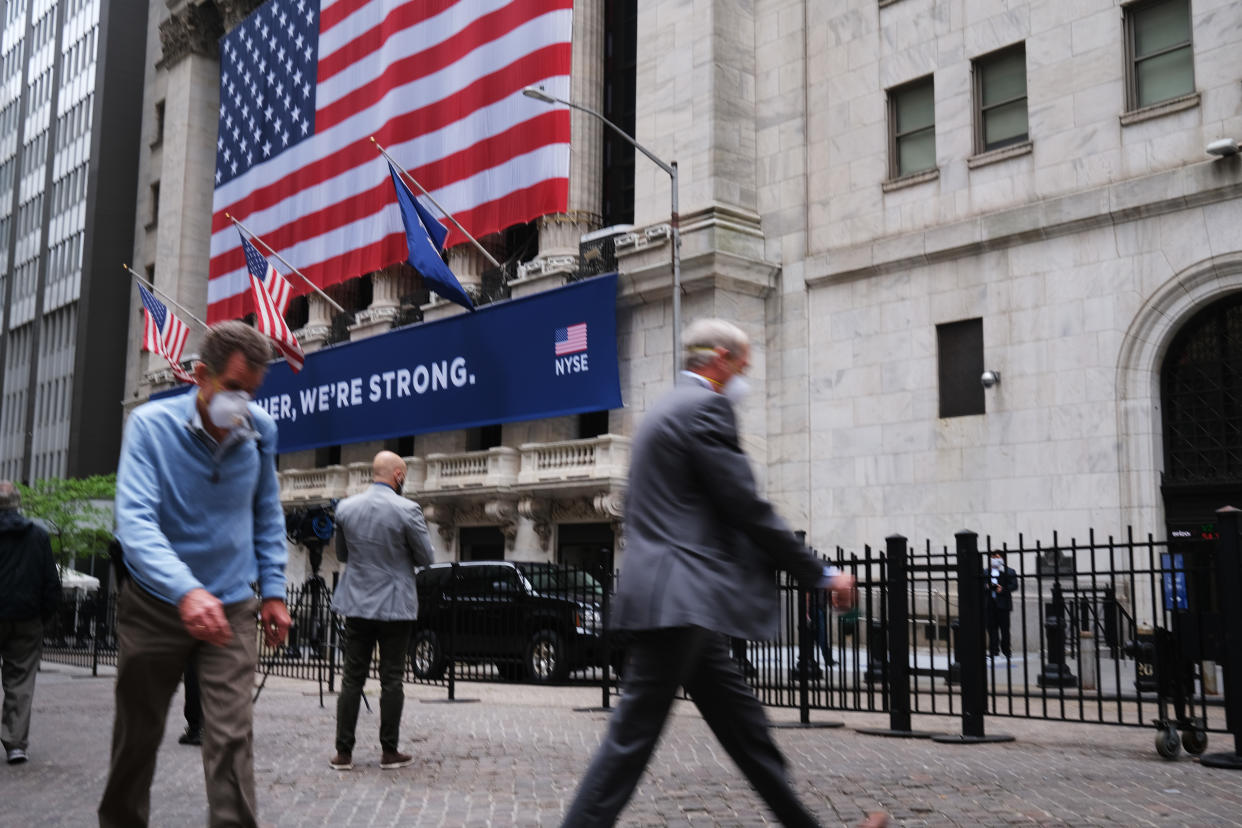 NEW YORK, NEW YORK - MAY 26: The New York Stock Exchange (NYSE) stands in lower Manhattan on the first day that traders are allowed back onto the historic floor of the exchange on May 26, 2020 in New York City. While only a small number of traders will be returning at this time, those that do will have to take temperature checks and wear face masks at all times while on the floor. The Dow rose over 600 points in morning trading as investors see economic activity in America picking up (Photo by Spencer Platt/Getty Images)