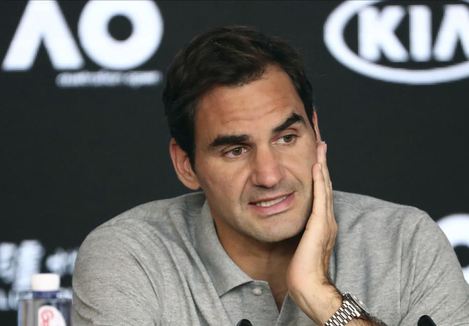 Switzerland's Roger Federer speaks during a press conference following his semifinal loss to Serbia's Novak Djokovic at the Australian Open tennis championship in Melbourne, Australia, Thursday, Jan. 30, 2020. (AP Photo/Dita Alangkara)