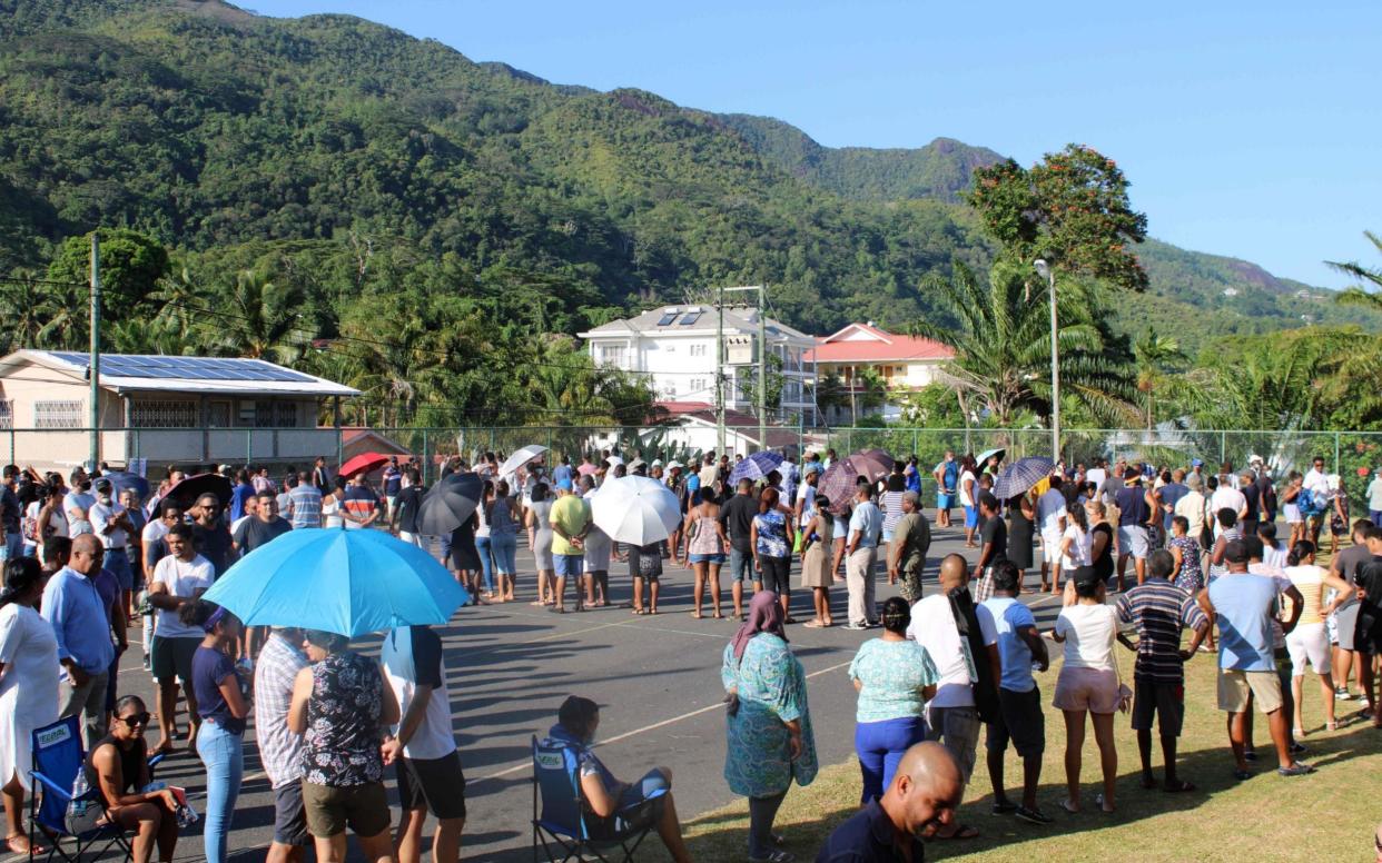 Voters queue to vote at the polling station of Bel Ombre in the North of Mahe, the main Island of the Seychelles - AFP