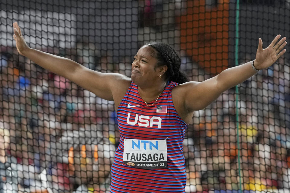 Laulauga Tausaga, of the United States, reacts after winning the gold medal in the Women's discus throw final during the World Athletics Championships in Budapest, Hungary, Tuesday, Aug. 22, 2023. (AP Photo/Matthias Schrader)