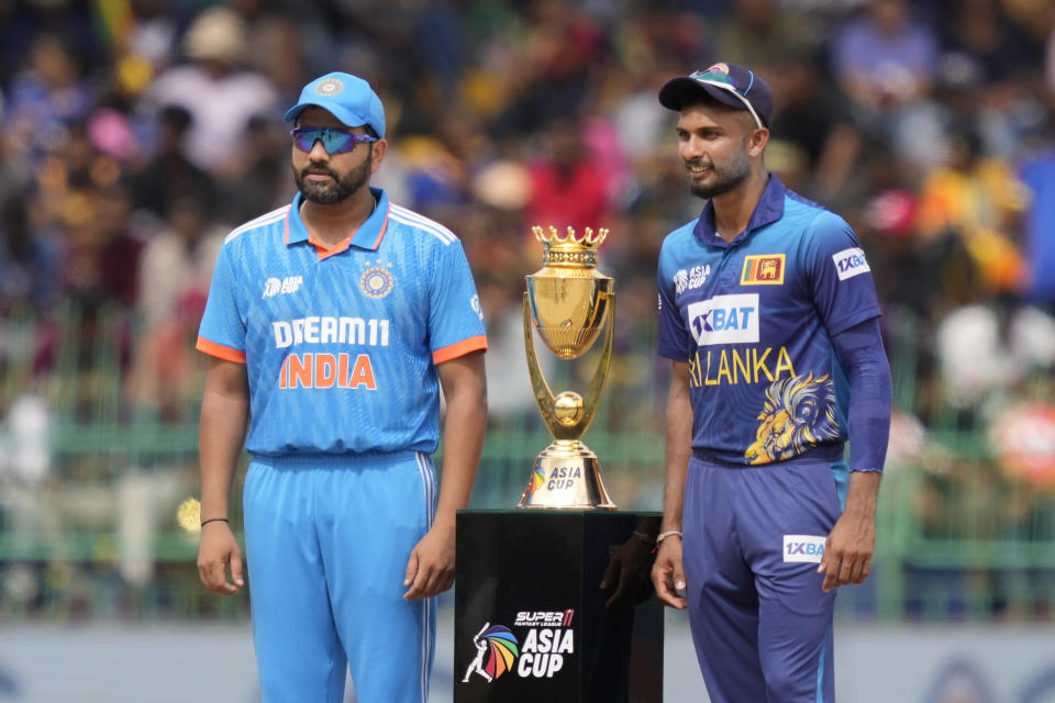 India's captain Rohit Sharma and his Sri Lankan counterpart Dasun Shanaka pose for photographs with trophy before the start of the Asia Cup final cricket match between India and Sri Lanka in Colombo, Sri Lanka, Sunday, Sep. 17, 2023. (AP Photo/Eranga Jayawardena)