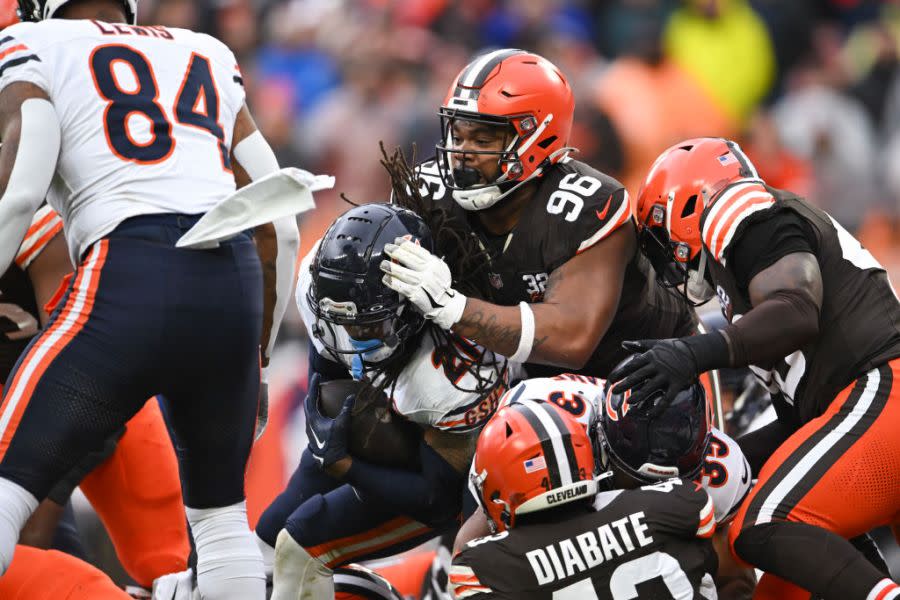 CLEVELAND, OHIO – DECEMBER 17: Jordan Elliott #96 of the Cleveland Browns tackles D’Onta Foreman #21 of the Chicago Bears during the second quarter of a game at Cleveland Browns Stadium on December 17, 2023 in Cleveland, Ohio. (Photo by Nick Cammett/Getty Images)