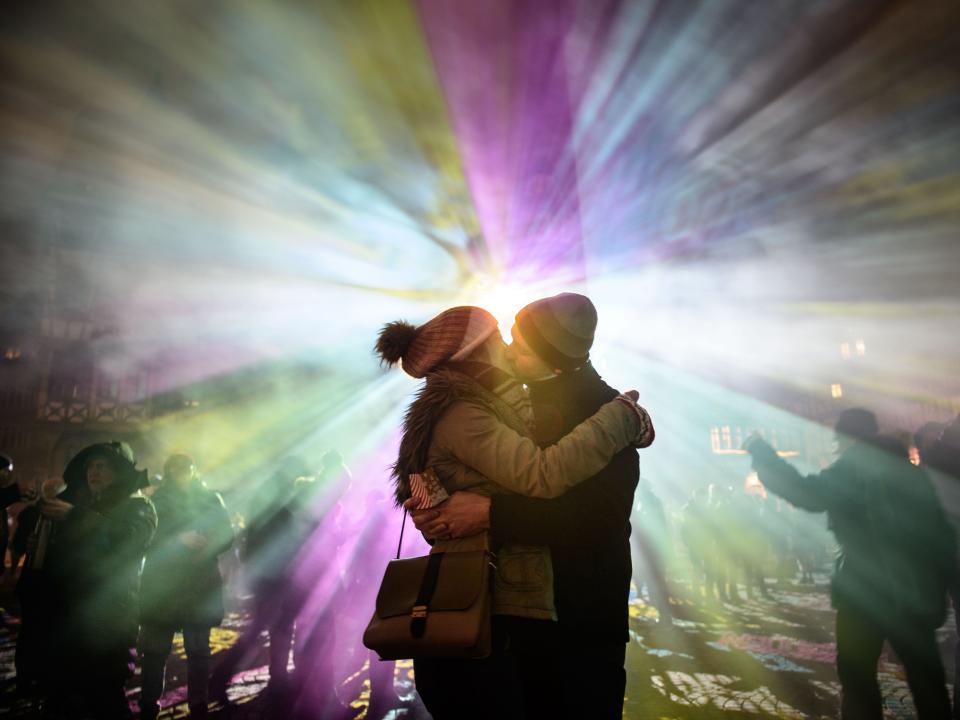 couple kissing at a festival