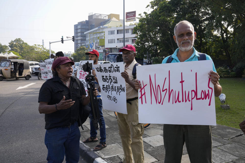 Sri Lankan social media activists hold placards with slogans against the proposed Online Safety Bill during a protest near the Parliament in Colombo, Sri Lanka, Tuesday, Jan. 23, 2024. (AP Photo/Eranga Jayawardena)