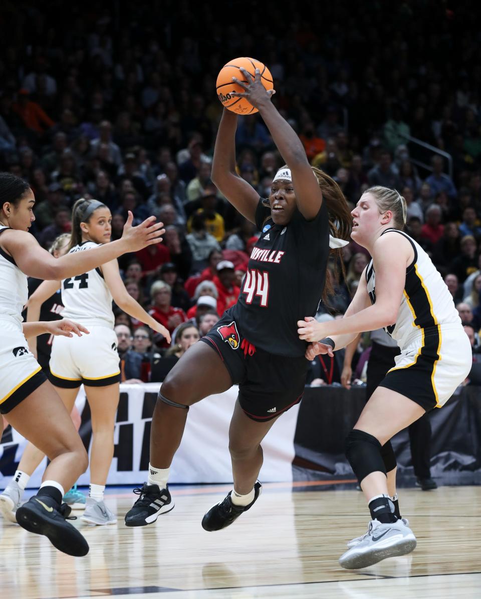 U of L's Olivia Cochran (44) maneuvers between the Iowa defense during the Elite 8 tournament at the Climate Pledge Arena in Seattle, W. on Mar. 26, 2023.