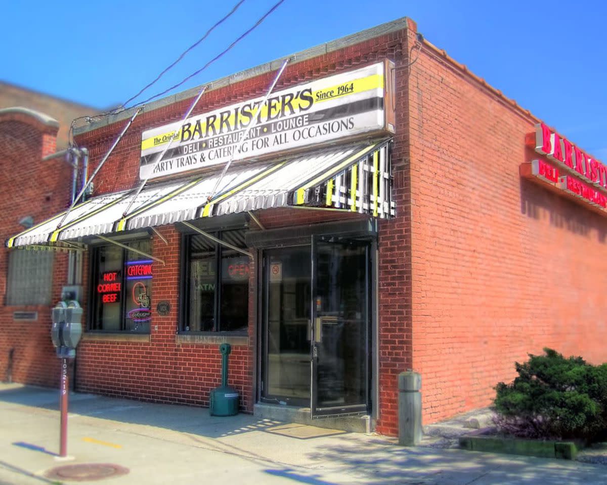 Front and side exterior of Horsey Roast Beef Sandwich, Barrister's, Cleveland, Ohio, made of red brick, sidewalk in the foreground on a sunny day