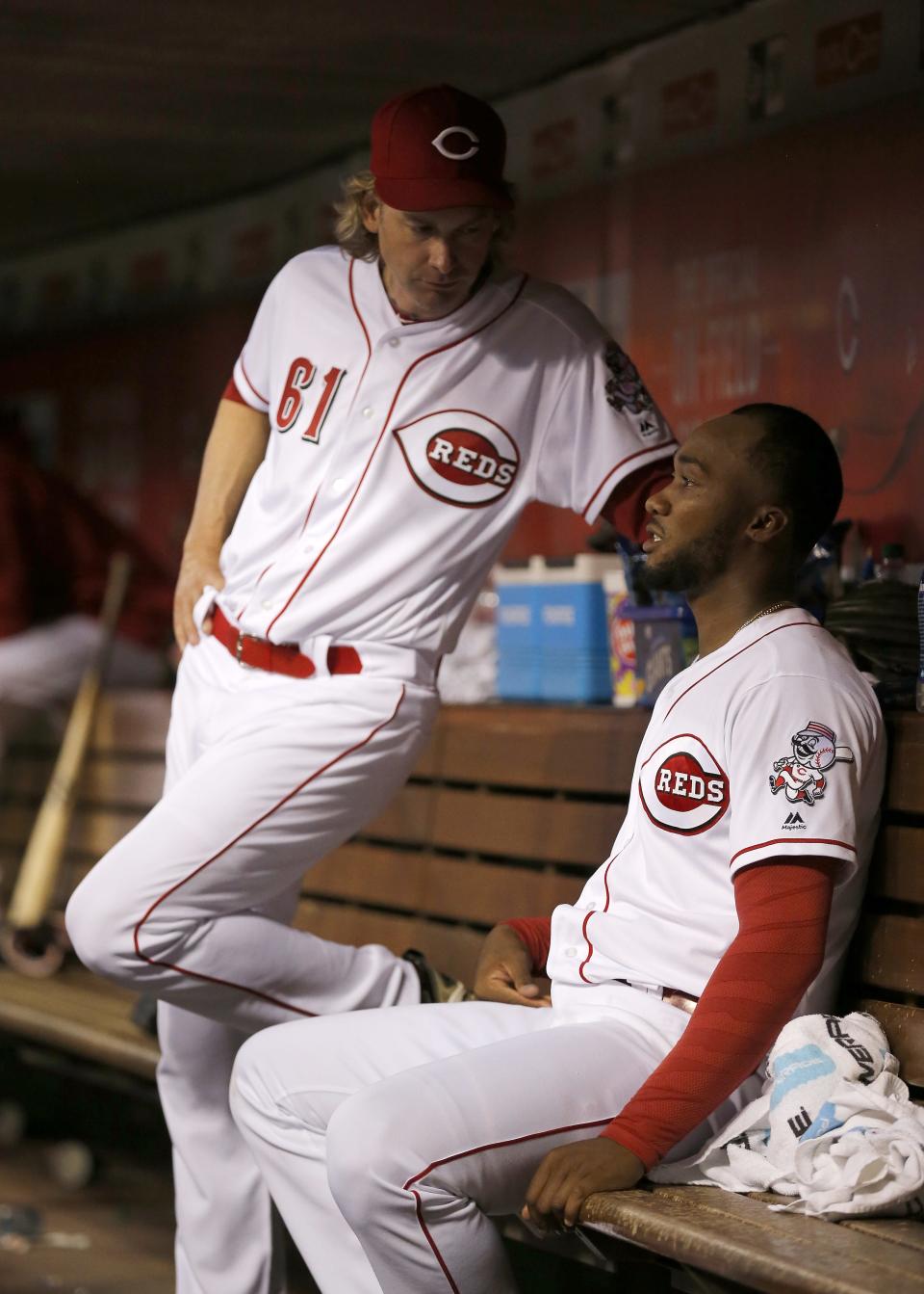 Bronson Arroyo, left, chats with former Reds pitcher Amir Garrett during a game against Cleveland in 2017.