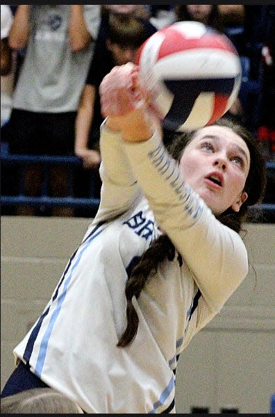 Bartlesville High School libero Mads Hyde focuses on passing the volleyball during a home victory on Aug. 31, 2023, against Glenpool High School.