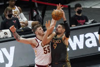 Chicago Bulls center Nikola Vucevic, right, drives to the basket against Cleveland Cavaliers center Isaiah Hartenstein during the second half of an NBA basketball game in Chicago, Saturday, April 17, 2021. (AP Photo/Nam Y. Huh)