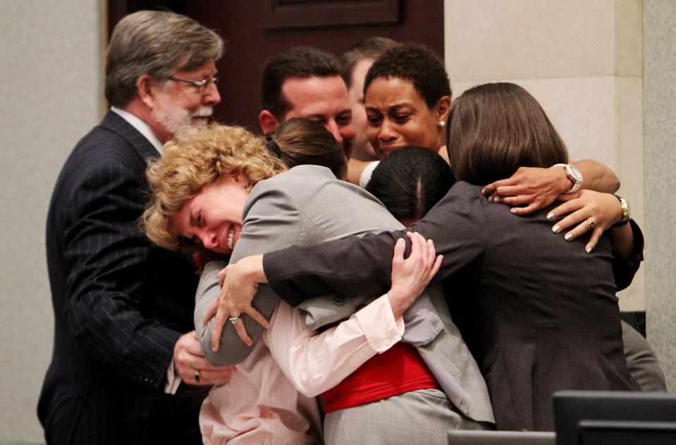 Defense attorney Dorothy Clay Sims, in gray jacket, hugs her client Casey Anthony, along with the rest of the defense team after Anthony was acquitted of murder charges at the Orange County Courthouse on July 5, 2011 in Orlando, Florida. Judge Jeffrey Ashton was the lead prosecutor on the case at the time.