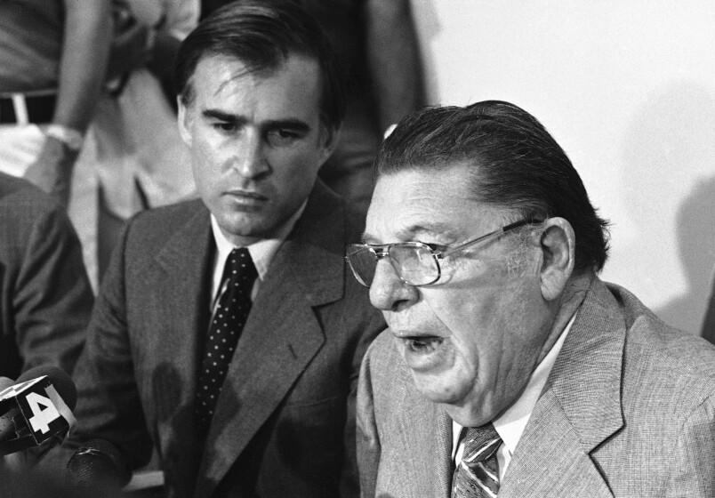 Gov. Jerry Brown Jr., left, and tax crusader Howard Jarvis, in their first public appearance together, told a packed news conference that they favor voluntary rent control in Los Angeles, Tuesday, July 18, 1978. Both urged landlords to “shape up” or be faced with new laws to force them to share benefits of Proposition 13 with tenants. (AP Photo/Robbins)