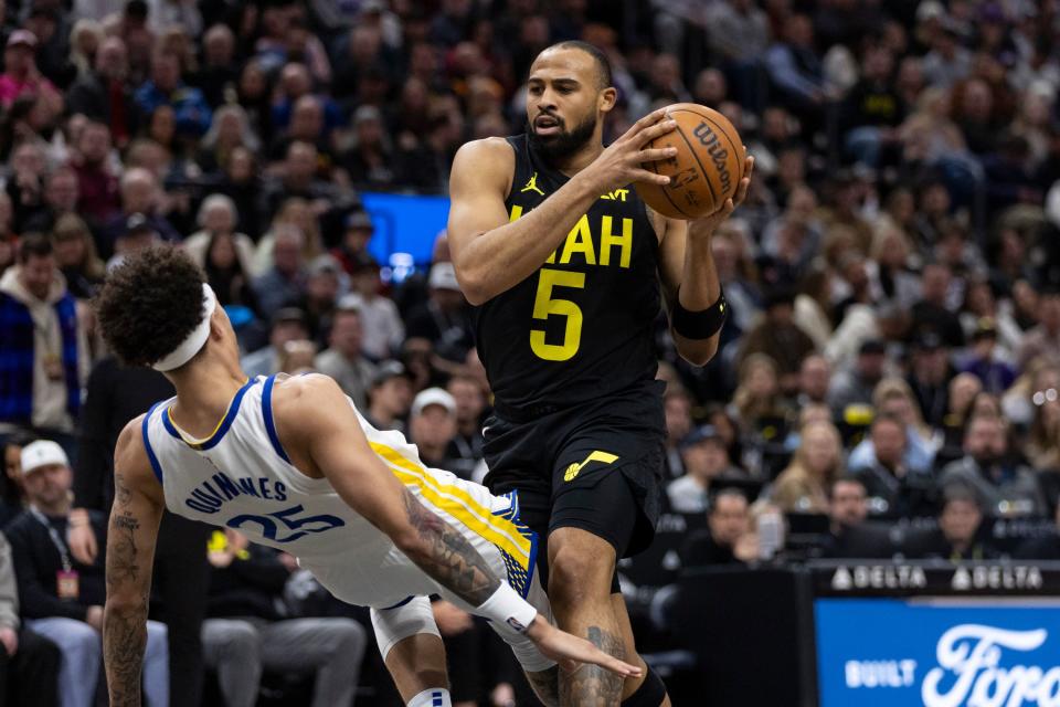 Utah Jazz guard <a class="link " href="https://sports.yahoo.com/nba/players/6234/" data-i13n="sec:content-canvas;subsec:anchor_text;elm:context_link" data-ylk="slk:Talen Horton-Tucker;sec:content-canvas;subsec:anchor_text;elm:context_link;itc:0">Talen Horton-Tucker</a> (5) drives to the basket hitting Golden State Warriors guard <a class="link " href="https://sports.yahoo.com/nba/players/6750/" data-i13n="sec:content-canvas;subsec:anchor_text;elm:context_link" data-ylk="slk:Lester Quinones;sec:content-canvas;subsec:anchor_text;elm:context_link;itc:0">Lester Quinones</a> (25) during a game at the Delta Center in Salt Lake City on Monday, Feb. 12, 2024. | Marielle Scott, Deseret News