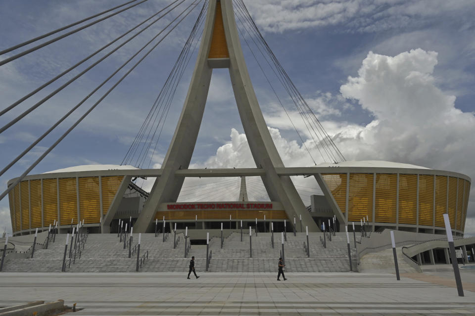 The Morodok Techo National Stadium is seen during a ceremony to hand it over to the Cambodian organizing committee of the Southeast Asian Games, in Phnom Penh, Cambodia, Sunday, Sept. 12, 2021. China's Foreign Minister Wang Yi, who attended the ceremony Sunday, met with Prime Minister Hun Sen and other officials to discuss COVID-19 and other regional issues. (Tang Chhin Sothy/Pool Photo via AP)