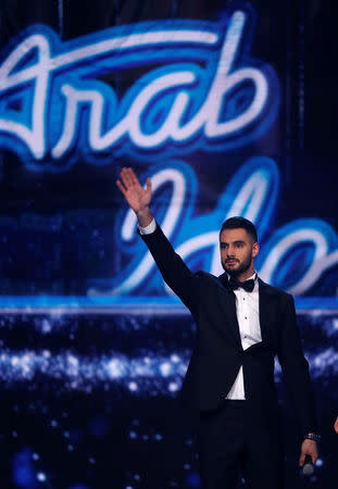 Palestinian contestant Yaqoub Shaheen gestures on stage during the final contest episode of the Arab Idol, before the announcement of the winner in Zouk Mosbeh area, north of Beirut, Lebanon February 25, 2017. REUTERS/Mohamed Azakir