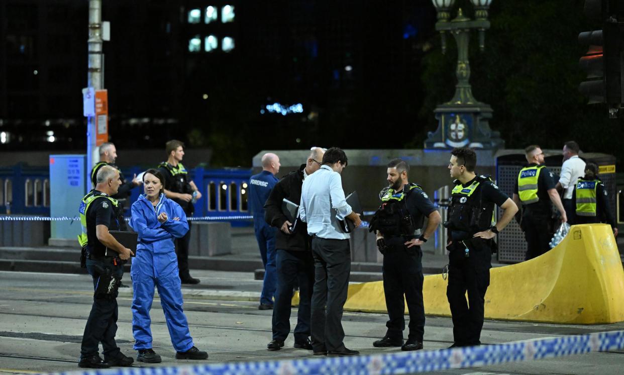 <span>Police officers at the scene of the incident on Princes Bridge in Melbourne.</span><span>Photograph: James Ross/AAP</span>