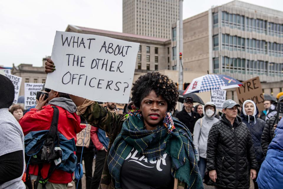 A woman protests in Memphis on Jan. 28, 2023 following the release of video showing the deadly encounter between Tyre Nichols and police.